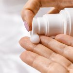 woman moisturizing for perfume longevity