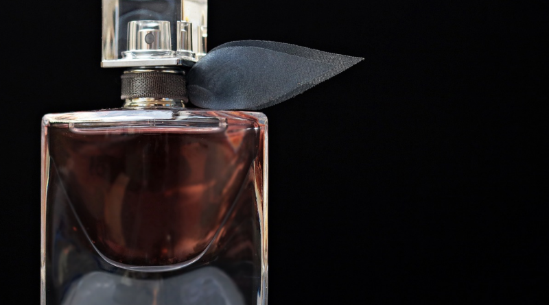 perfume bottle against black background