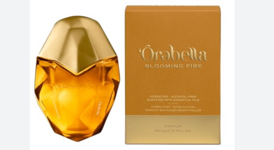 Orebella Blooming Fire parfum in its golden geode-shaped bottle next to its gold box 