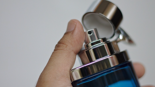 thumb on perfume bottle spritzer 